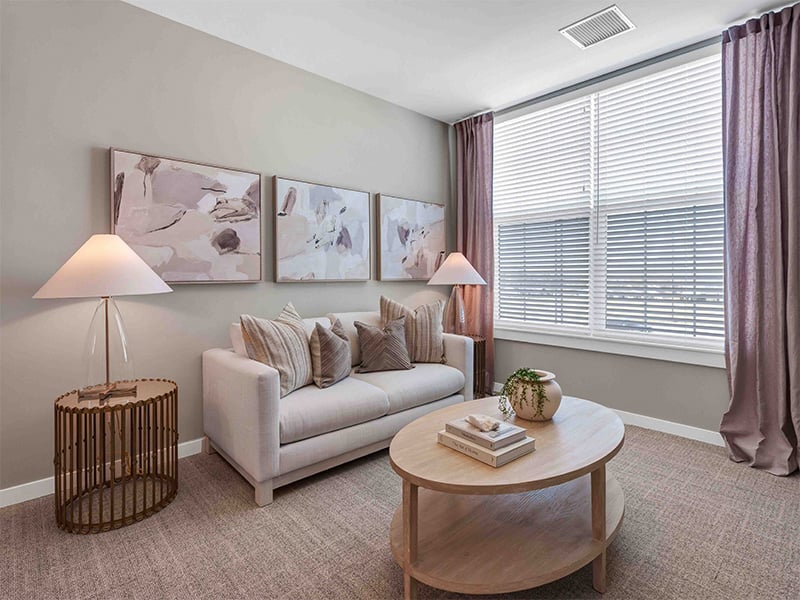 A spacious and bright living room inside a senior apartment at Cedarhurst of Wentzville