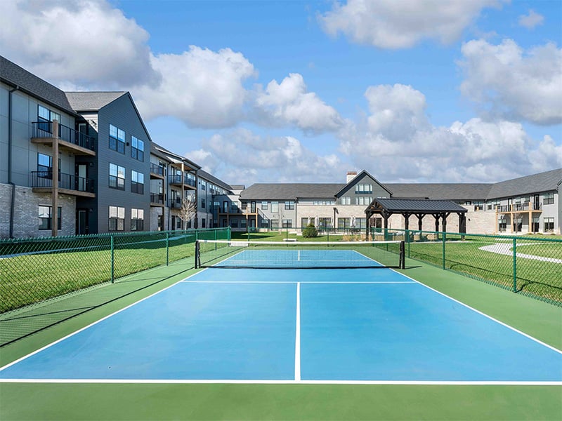 Outdoor pickleball court, part of Cedarhurst of Wentzville's extensive outdoor amenities for residents, which also includes landscaped grounds and walking paths