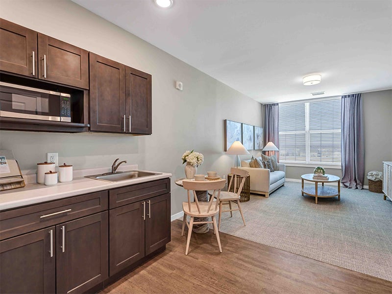 An accessible kitchenette in a senior apartment at Cedarhurst of Wentzville, designed for ease of use and independence