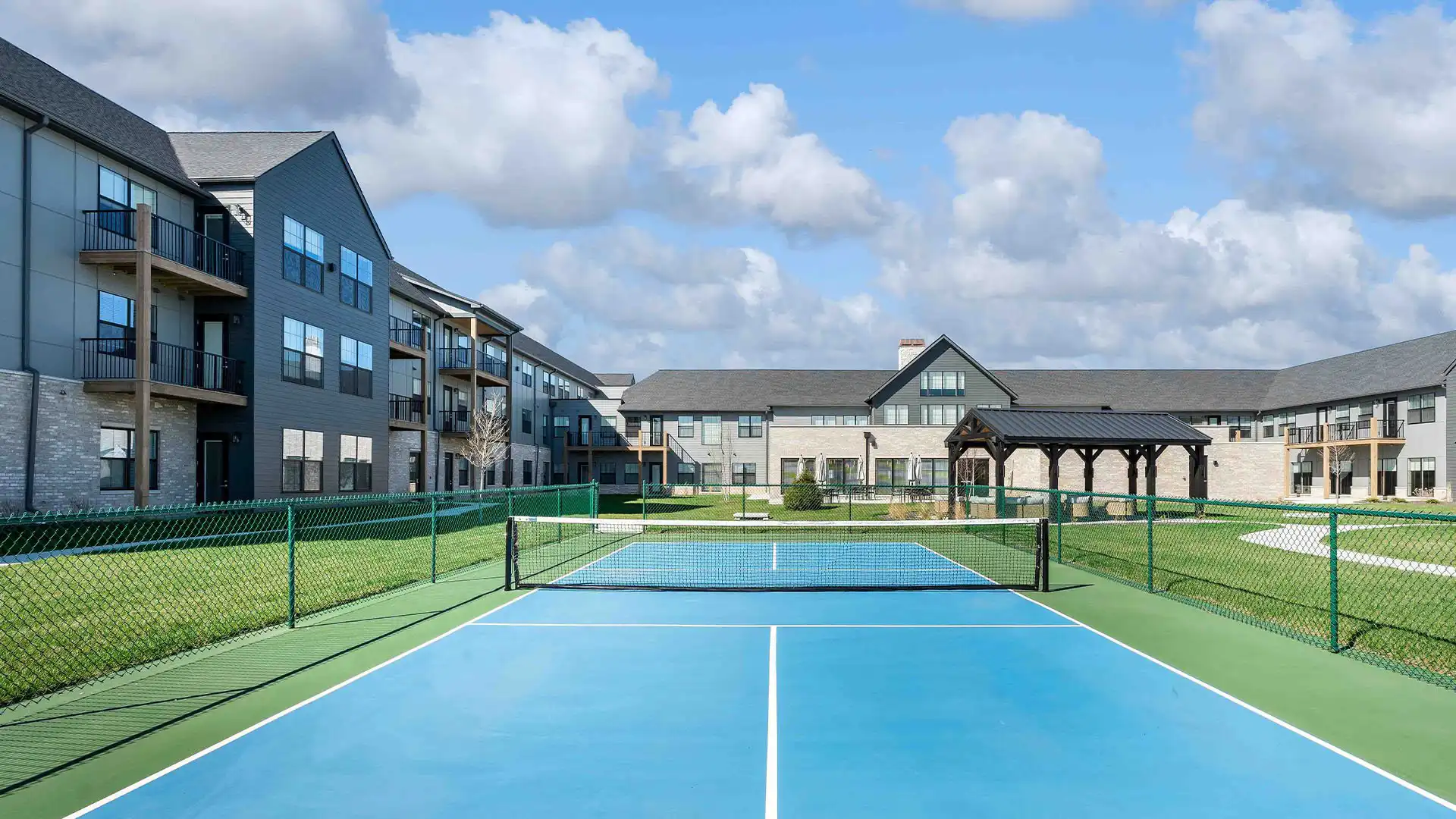Outdoor pickleball court, part of Cedarhurst of Wentzville's extensive outdoor amenities for residents, which also includes landscaped grounds and walking paths