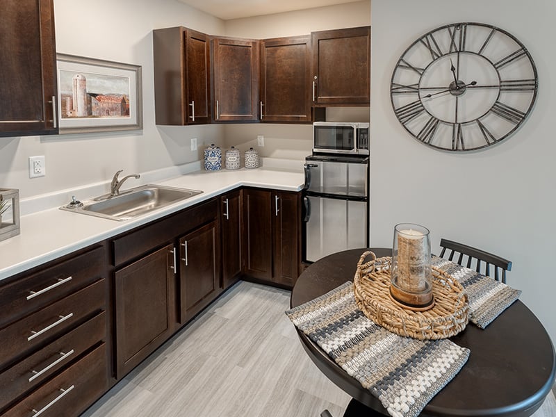 An accessible kitchenette in a senior apartment at Cedarhurst of West Plains, designed for ease of use and independence.