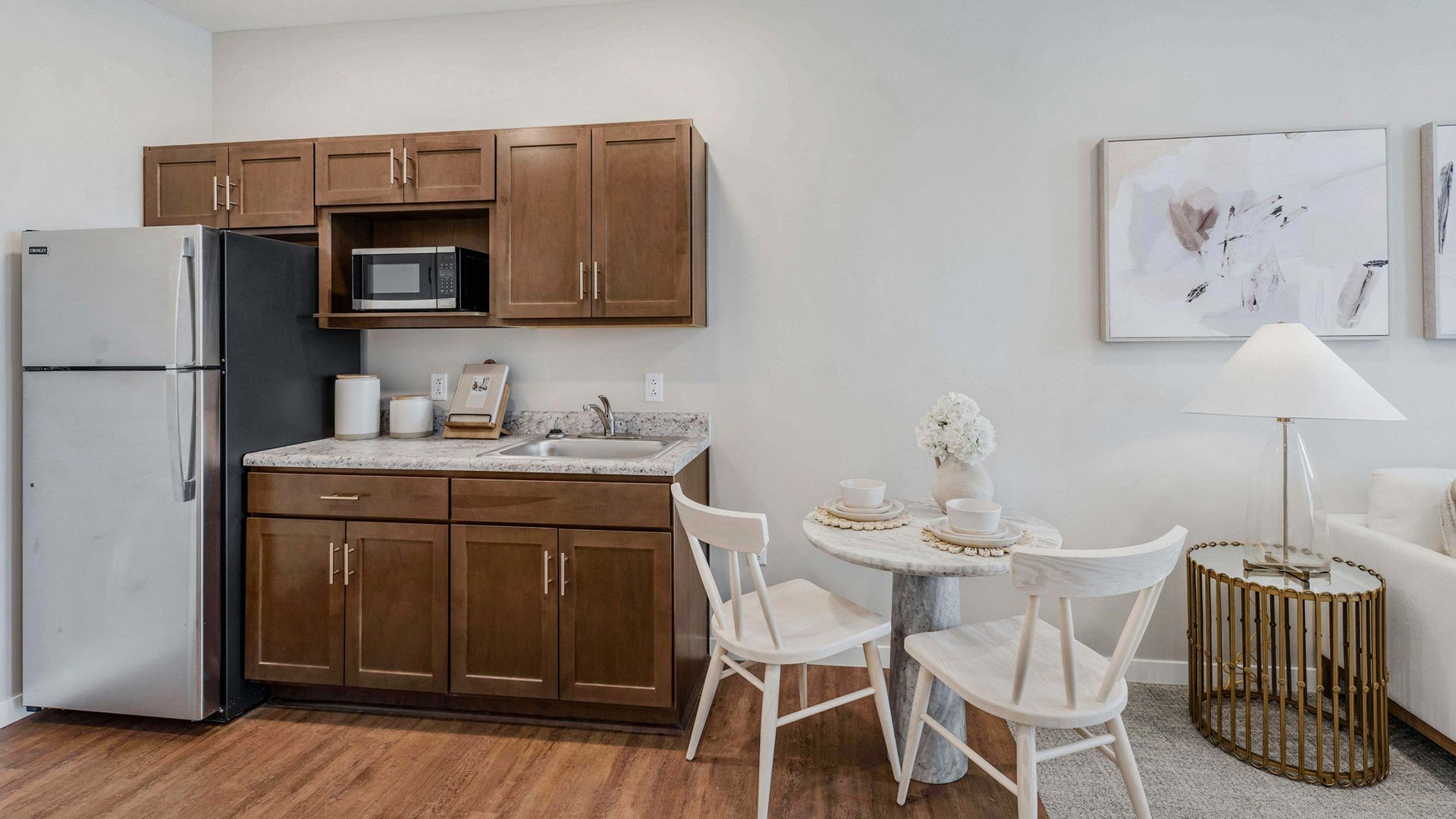 An accessible kitchenette in a senior apartment at Cedarhurst of  Wichita, designed for ease of use and independence