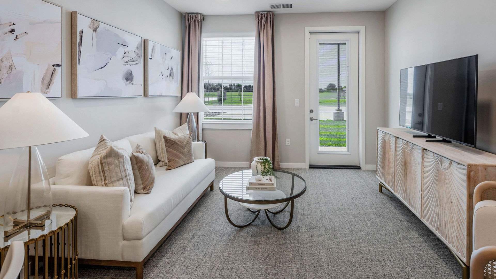 Senior-friendly apartment living room at Cedarhurst of Wichita, offering comfortable and accessible design for residents