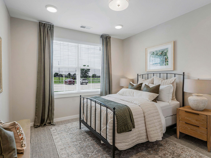 Bedroom of a senior apartment at Cedarhurst of Wichita, designed for resident comfort and personalization
