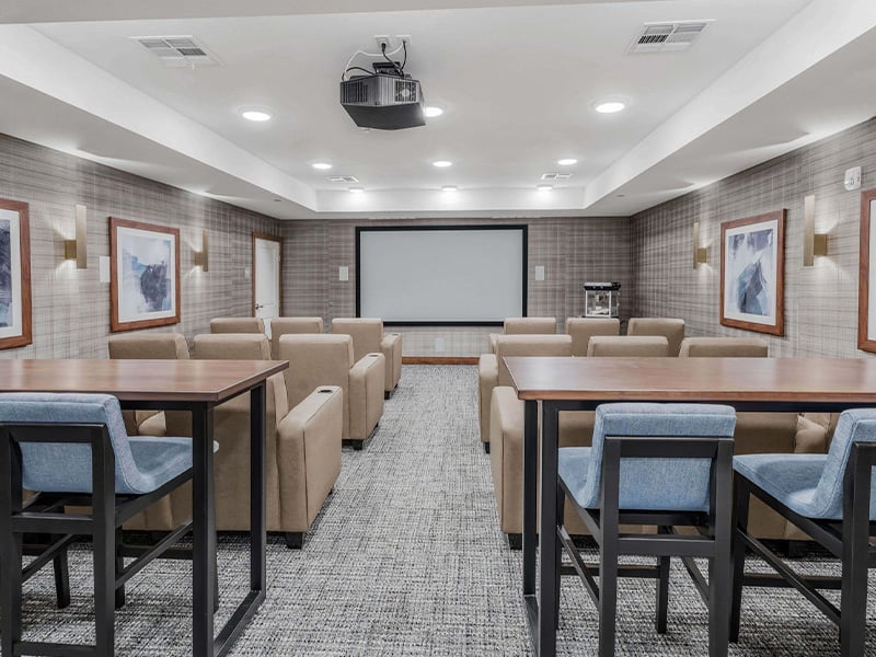 The comfortable and accessible movie theater at Cedarhurst of  Wichita, providing easy-to-access entertainment for residents