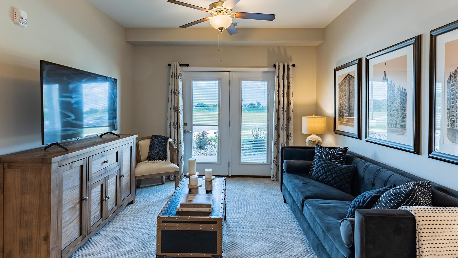 Senior-friendly apartment living room at Cedarhurst of Woodstock, offering comfortable and accessible design for residents