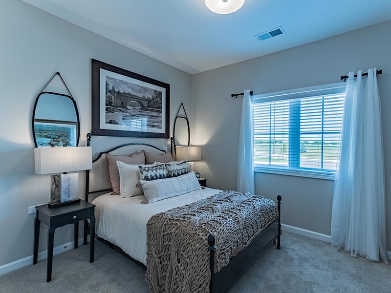 Bedroom of a senior apartment at Cedarhurst of Woodstock, designed for resident comfort and personalization