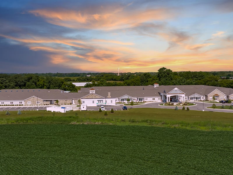 Aerial view of the entire Cedarhurst of Woodstock  senior living community building and grounds