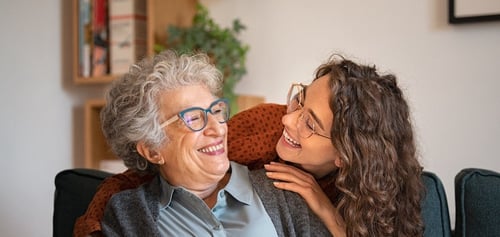 senior woman and caregiver exercising