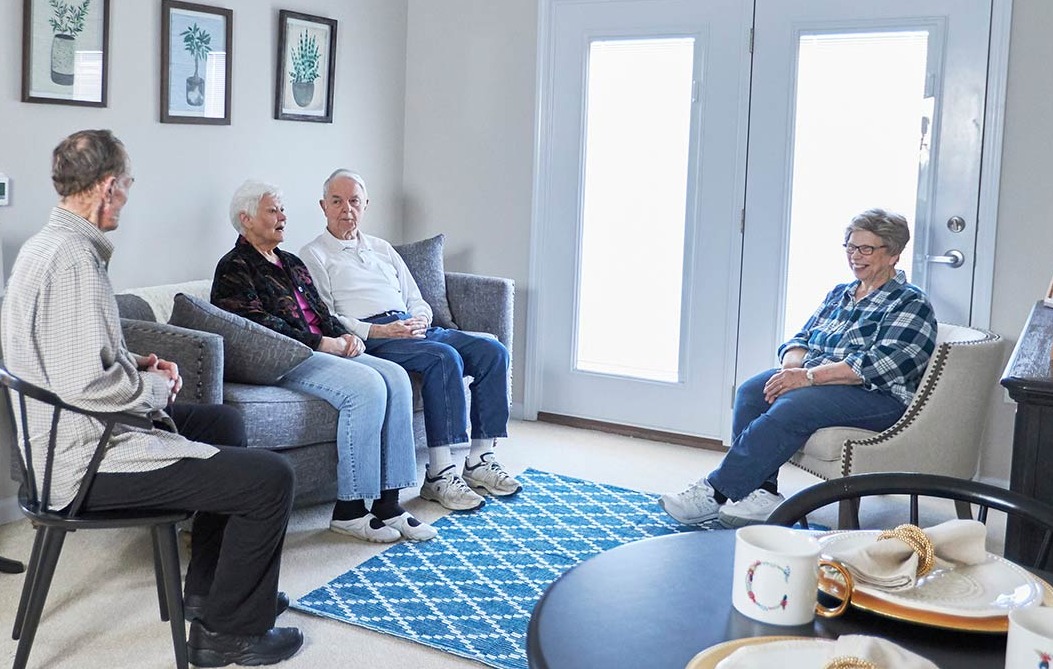 Group of seniors sitting in a living room