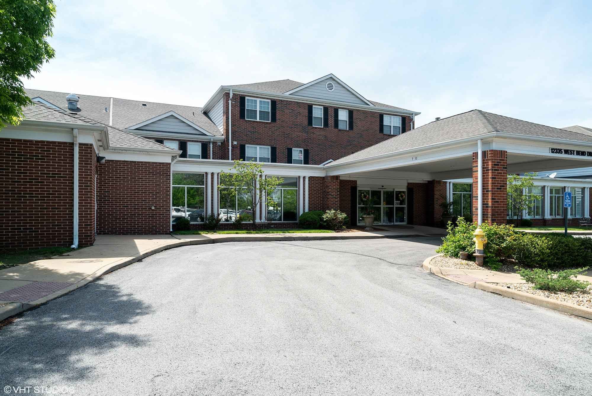 Tesson Heights building, a two-story structure with a large portico in front