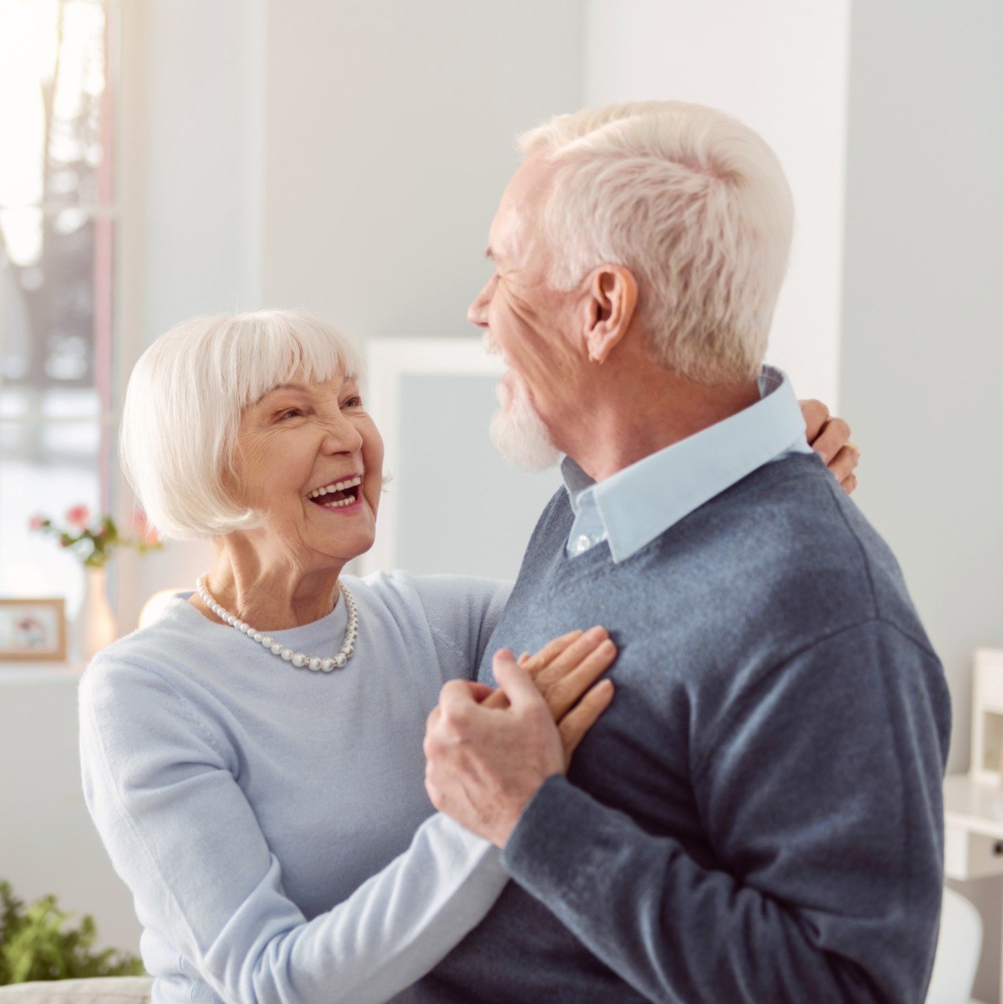 a senior couple dancing