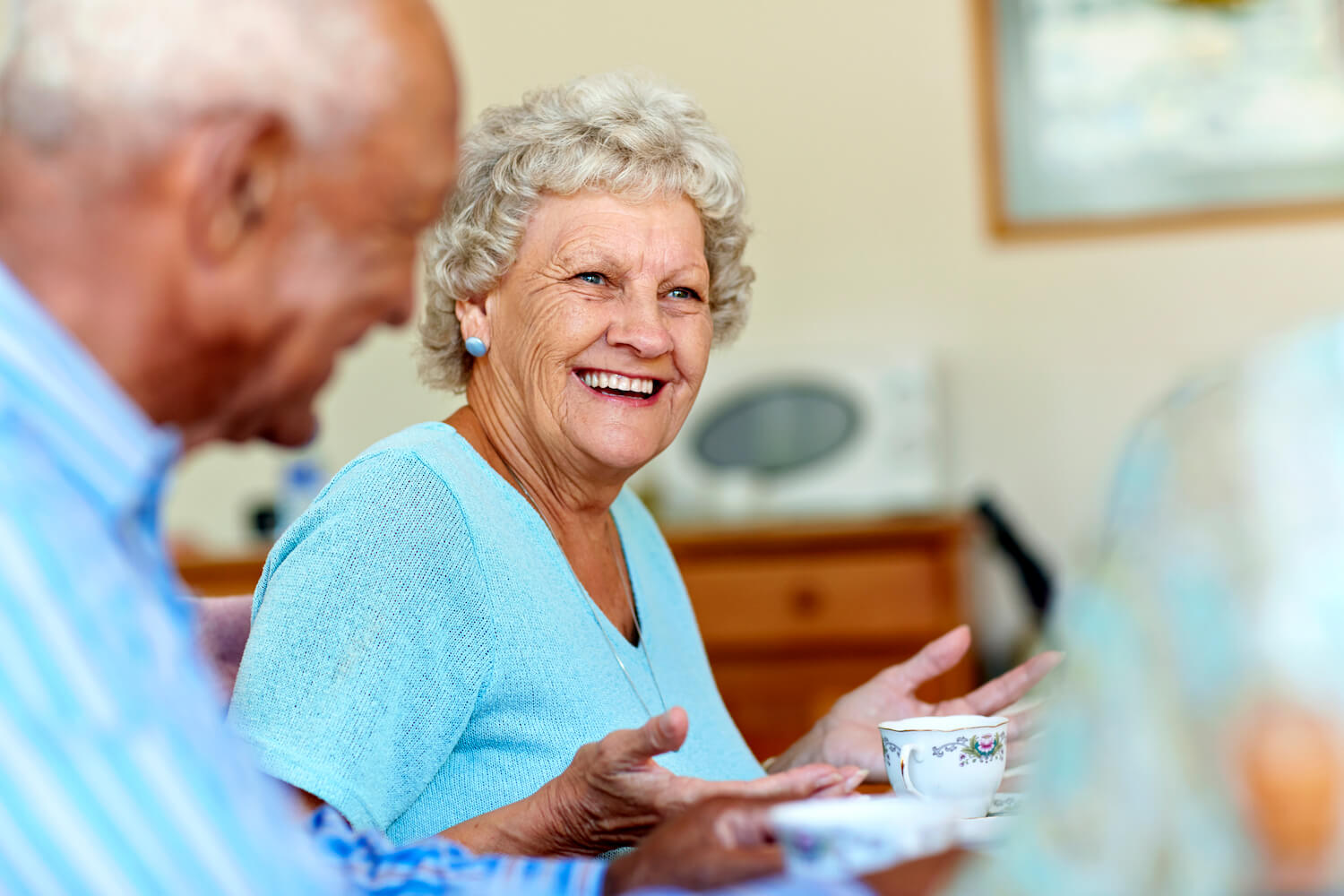 Senior woman chatting with friends