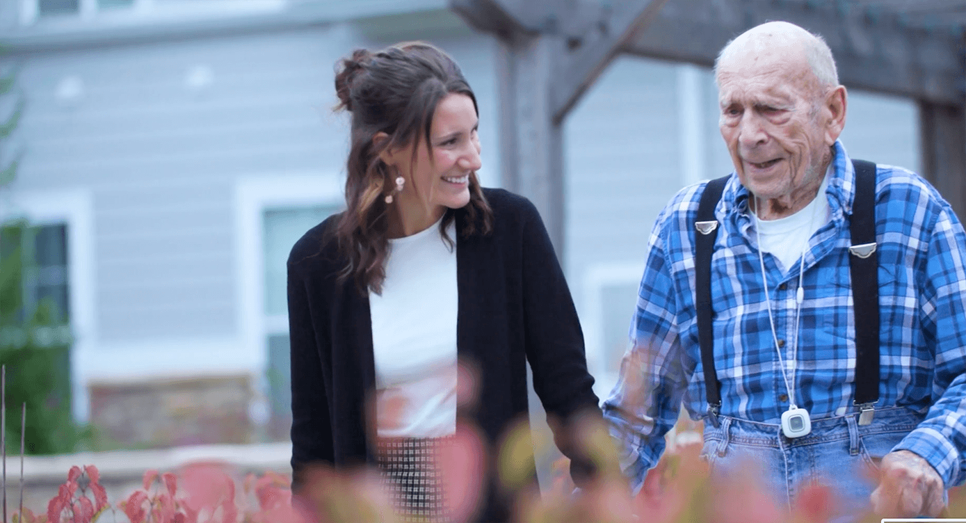 Memory care resident with senior living staff member