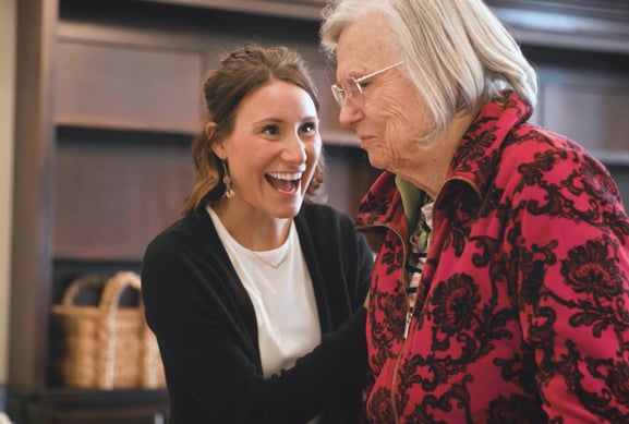 Memory Care senior resident being assisted by caretaker