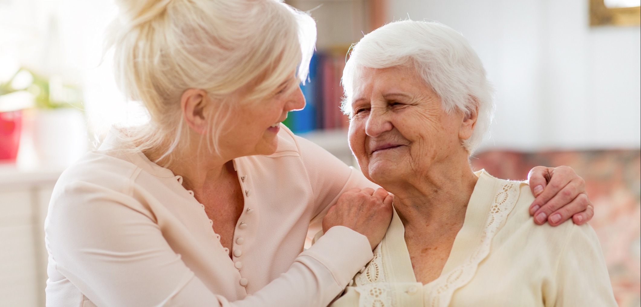 Senior woman spending quality time with her daughter-1145256911