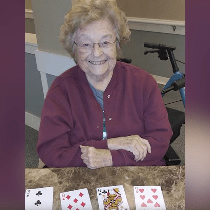 Memory care resident playing cards