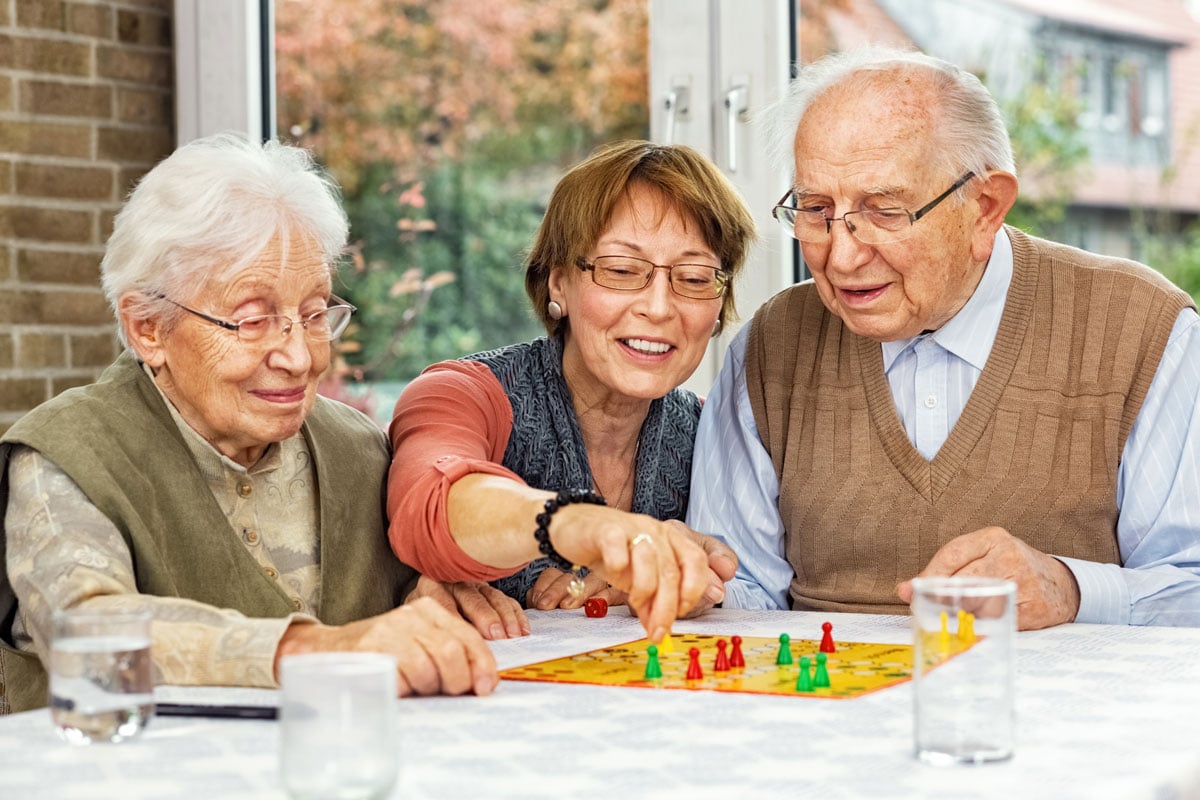 Memory care residence playing a game