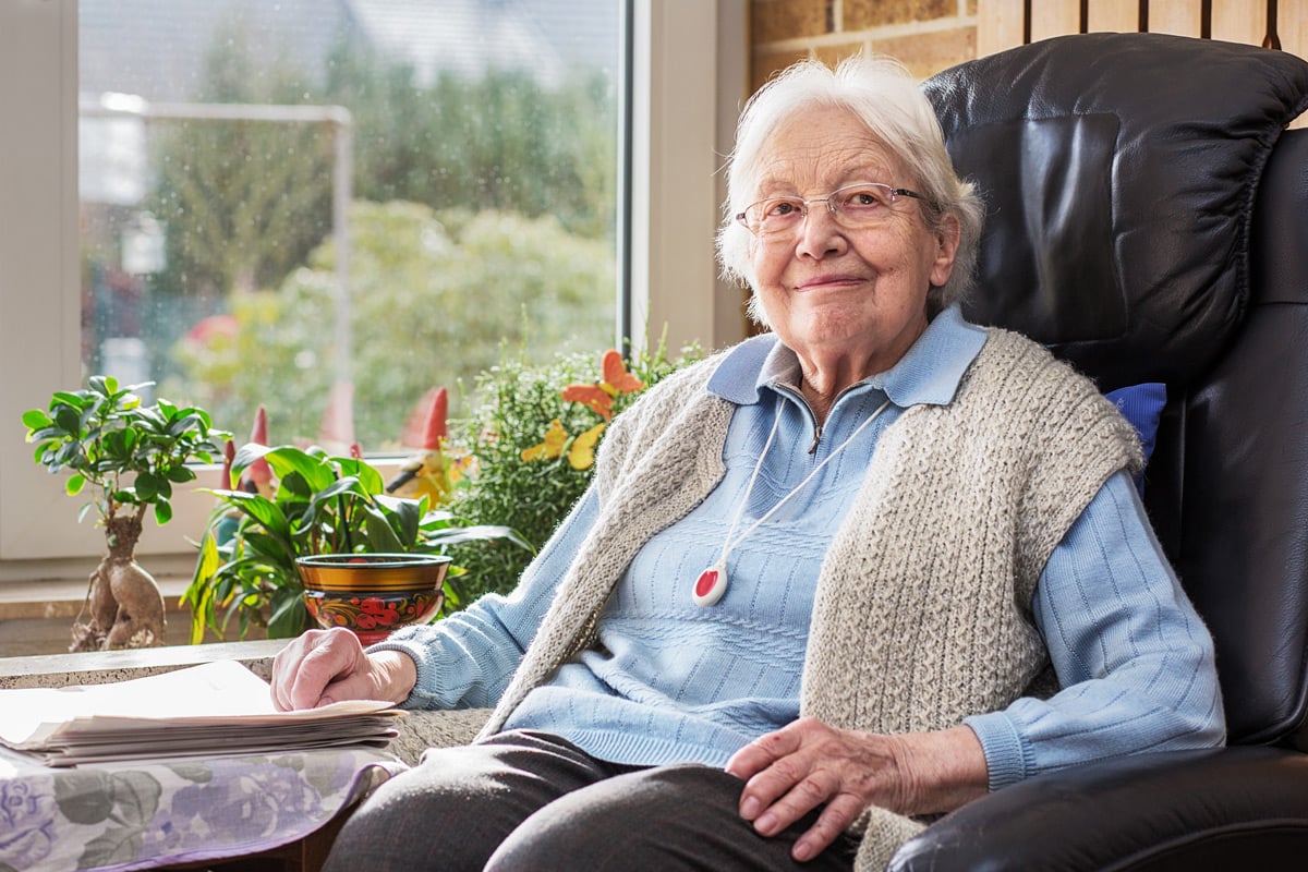 memory care senior resident sitting in recliner chair