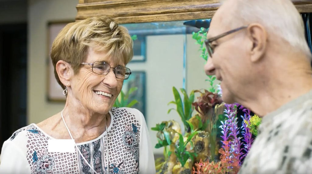 senior residents chatting with each other in the memory care department