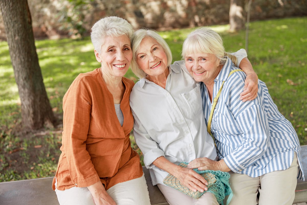senior woman friends smiling outside