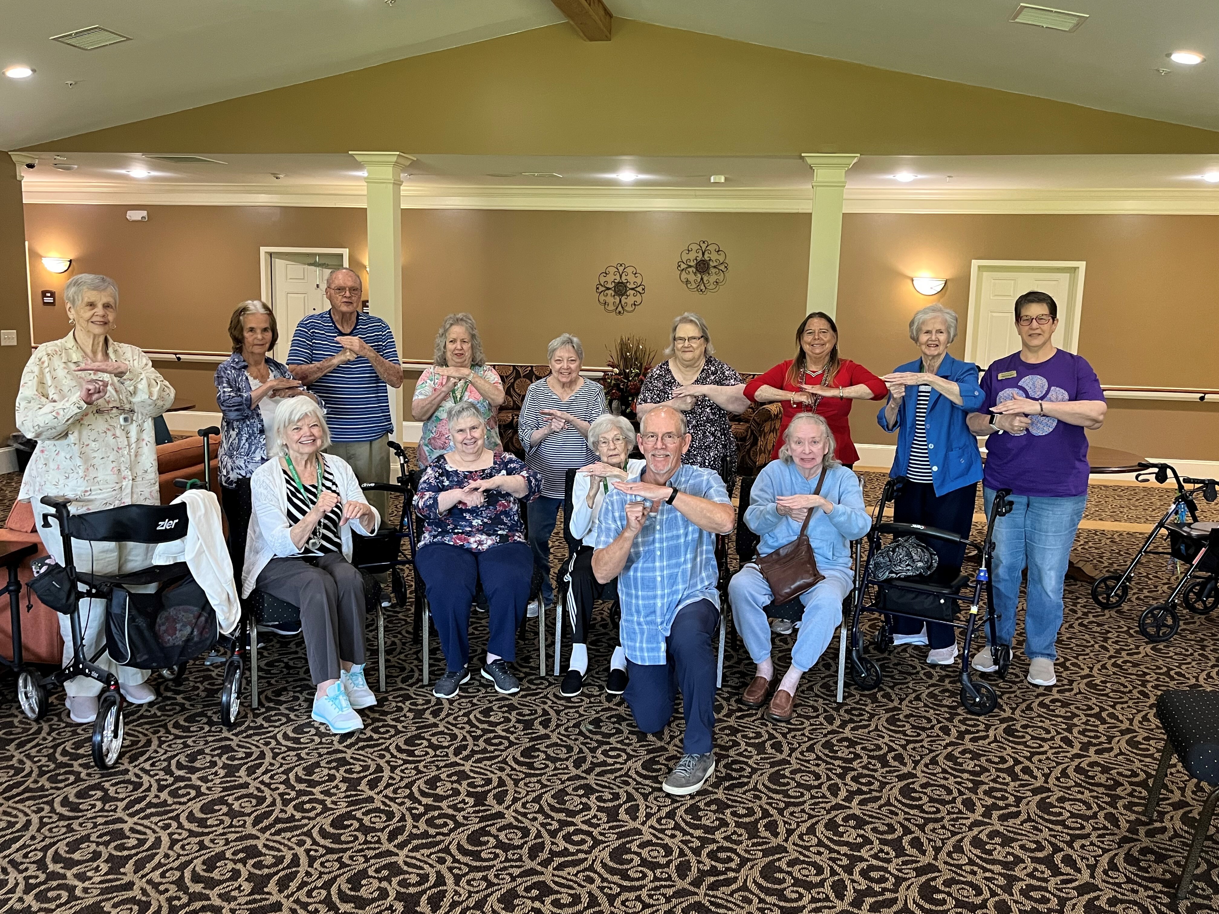 Cedarhurst of Canton residents pose with Tai Chi instructor Randy Hallman after completing a 16-week course focused on improving mobility and emotional well-being.