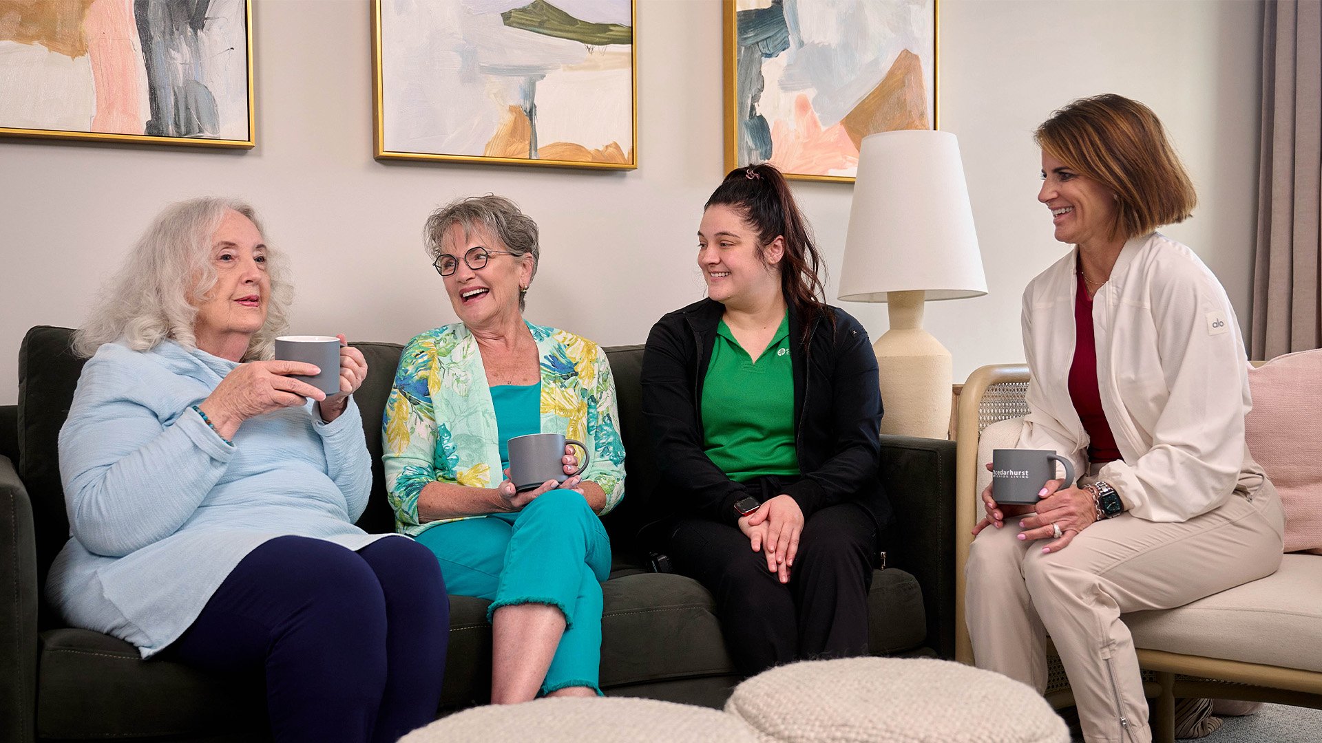 Senior living residents talking to each other sitting on the couch