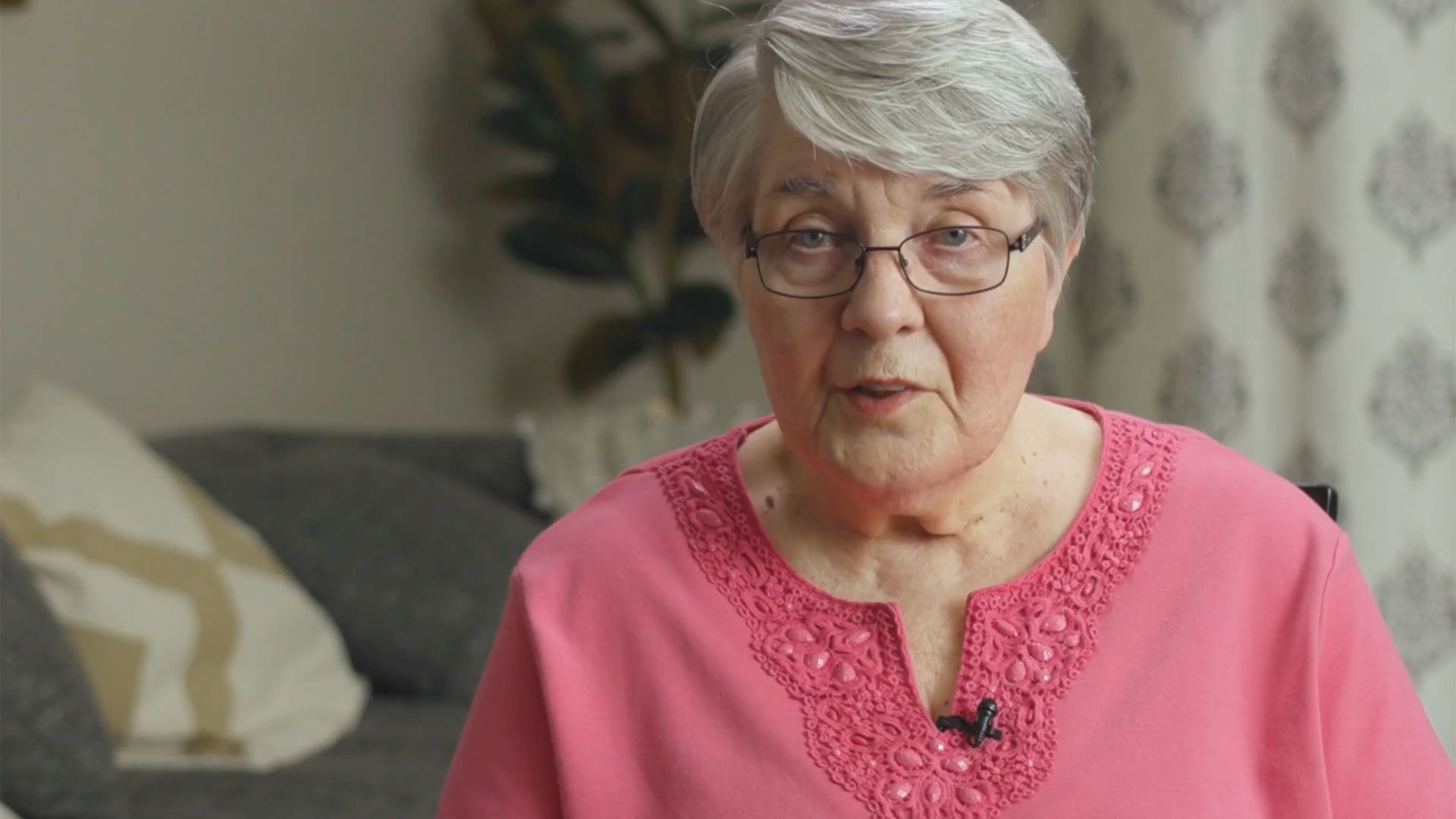 A senior woman resident looking at the camera
