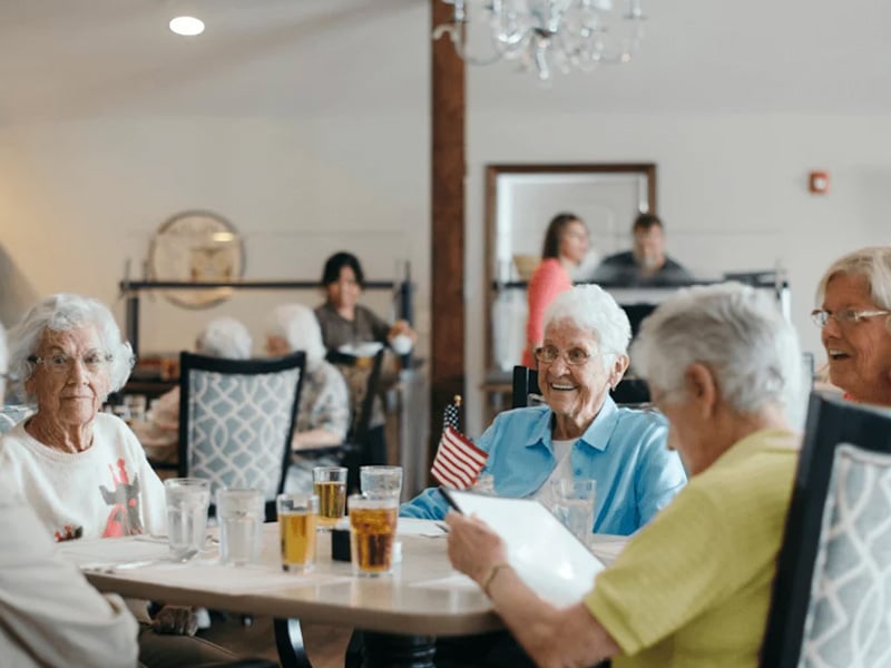 Group of senior residents dining together