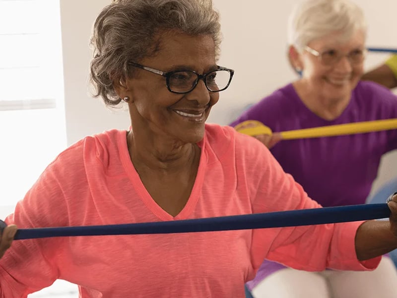 seniors using resistance bands in exercise class