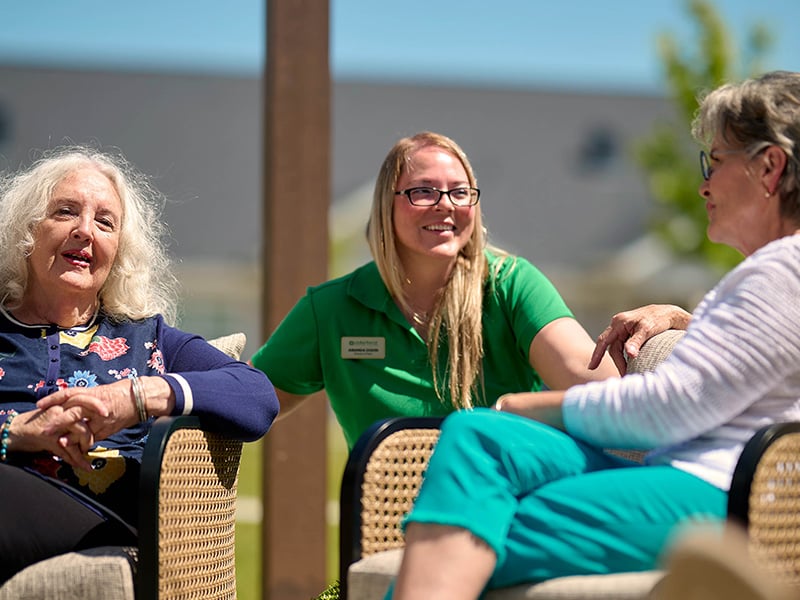 Staff member chatting with senior residents
