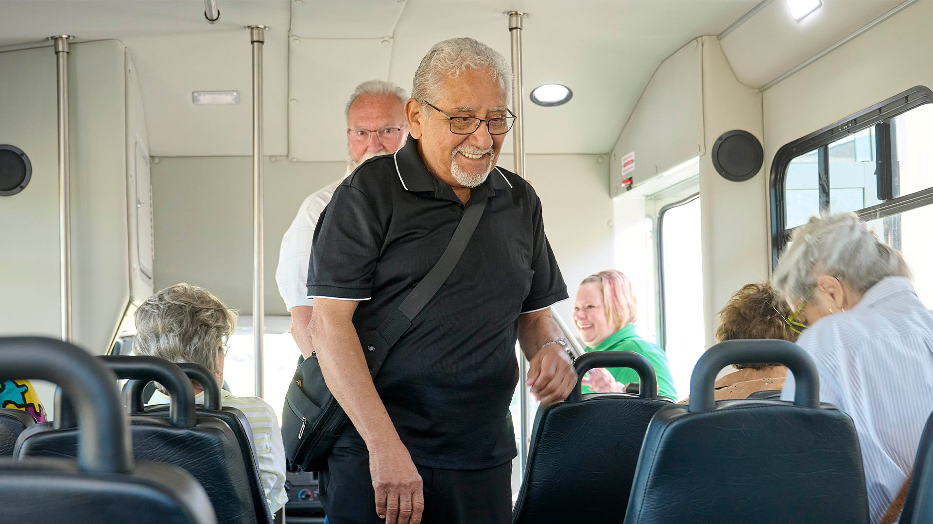 Senior man getting in a bus