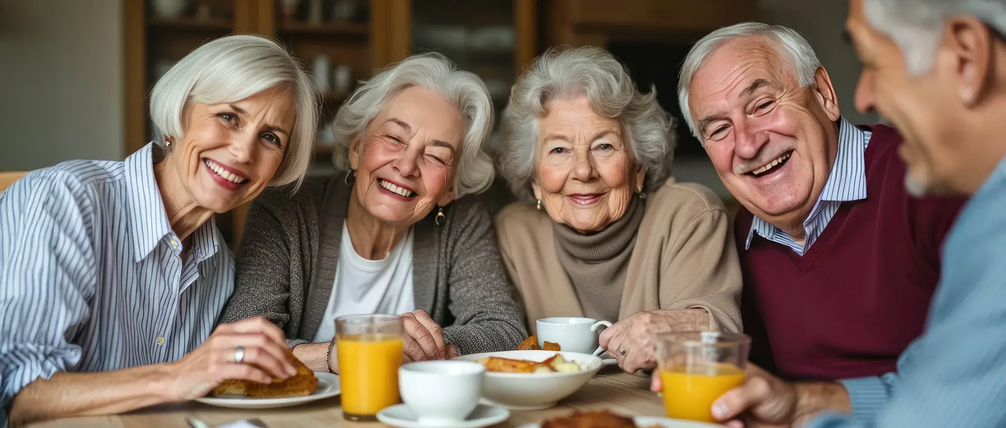 group of seniors having breakfast together