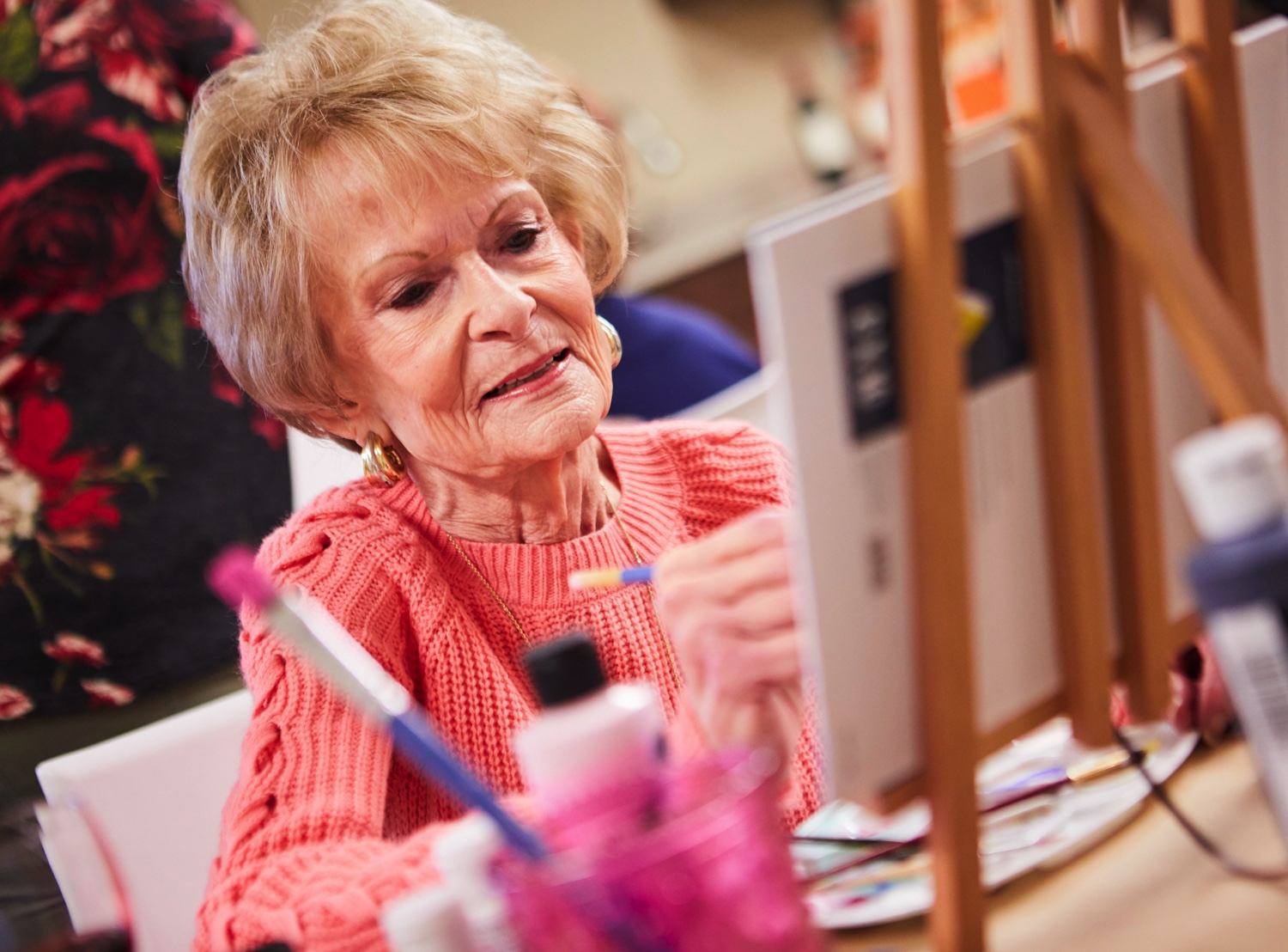 Senior Woman Painting in Art Class