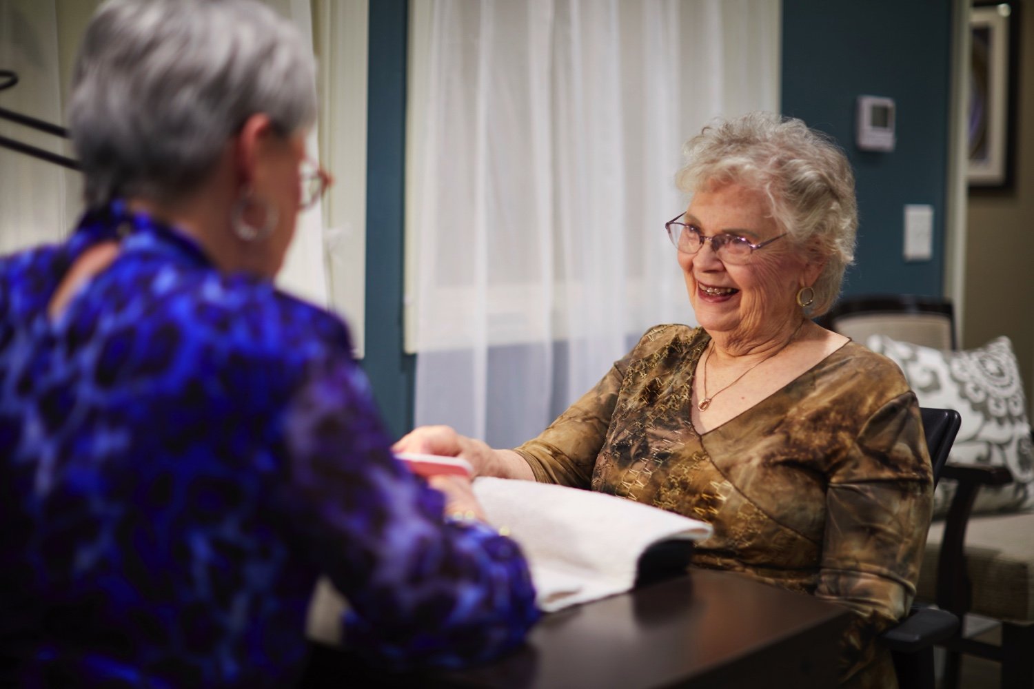 Senior getting nails done in the community salon