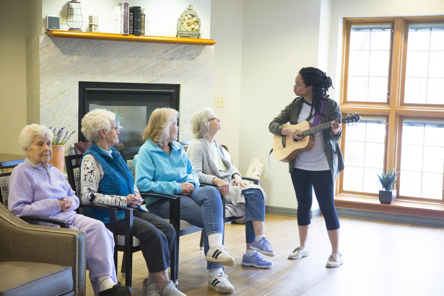 Musician Playing for four senior women