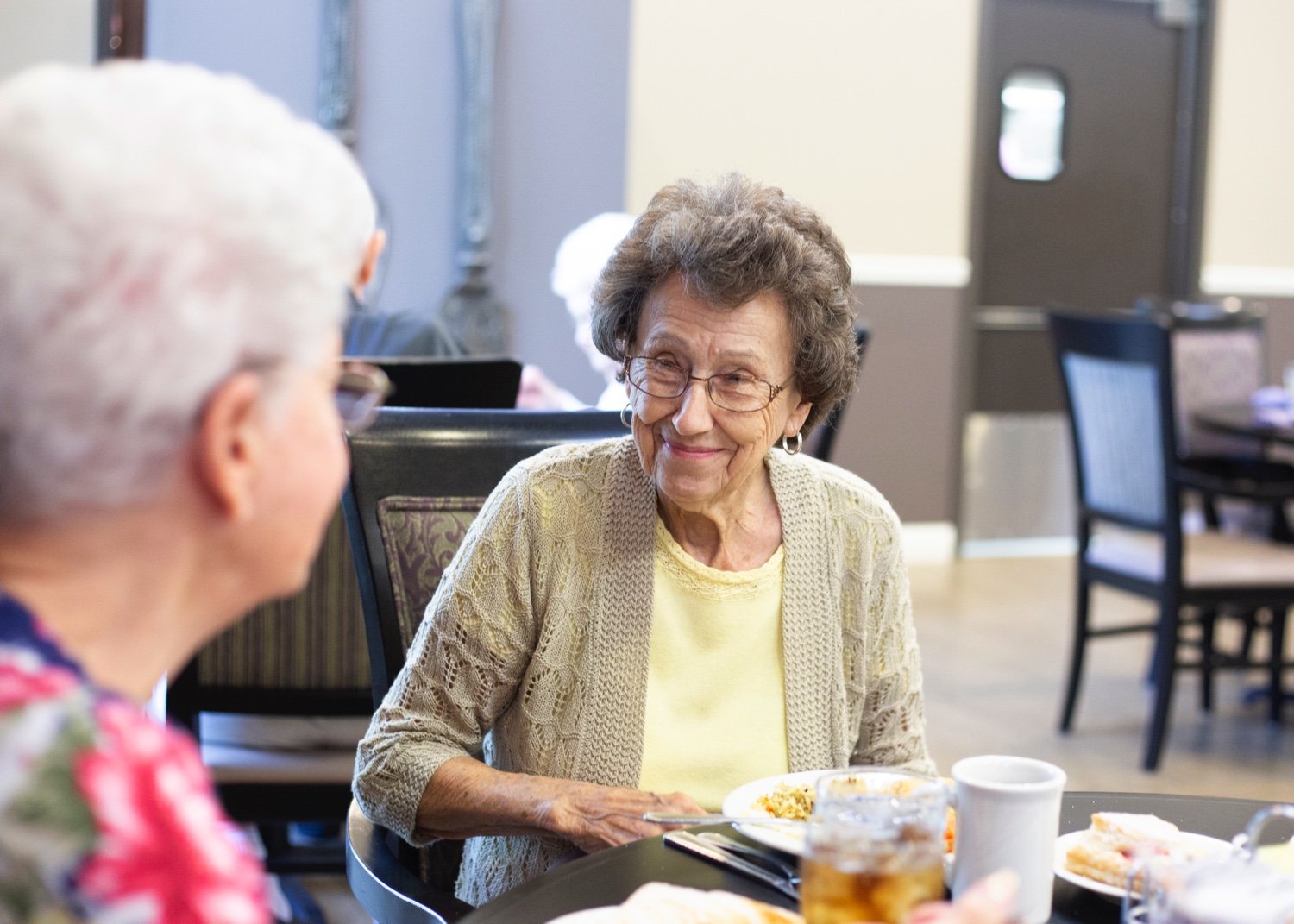 Residents Dining and Having Conversation