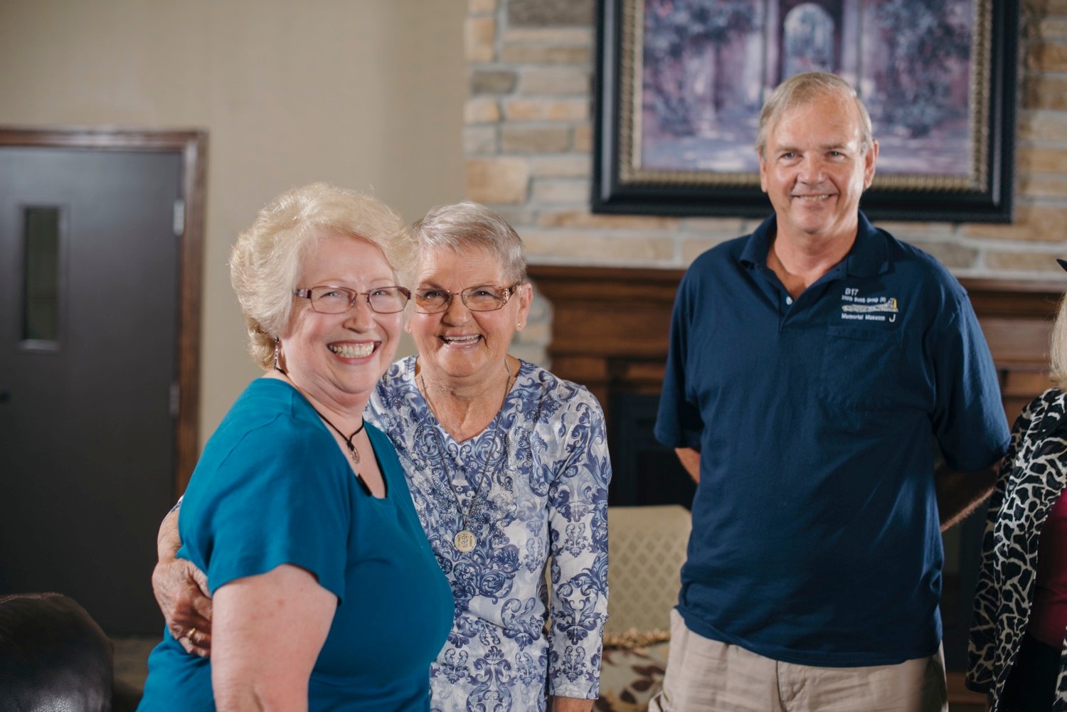 Staff member smiling with senior women