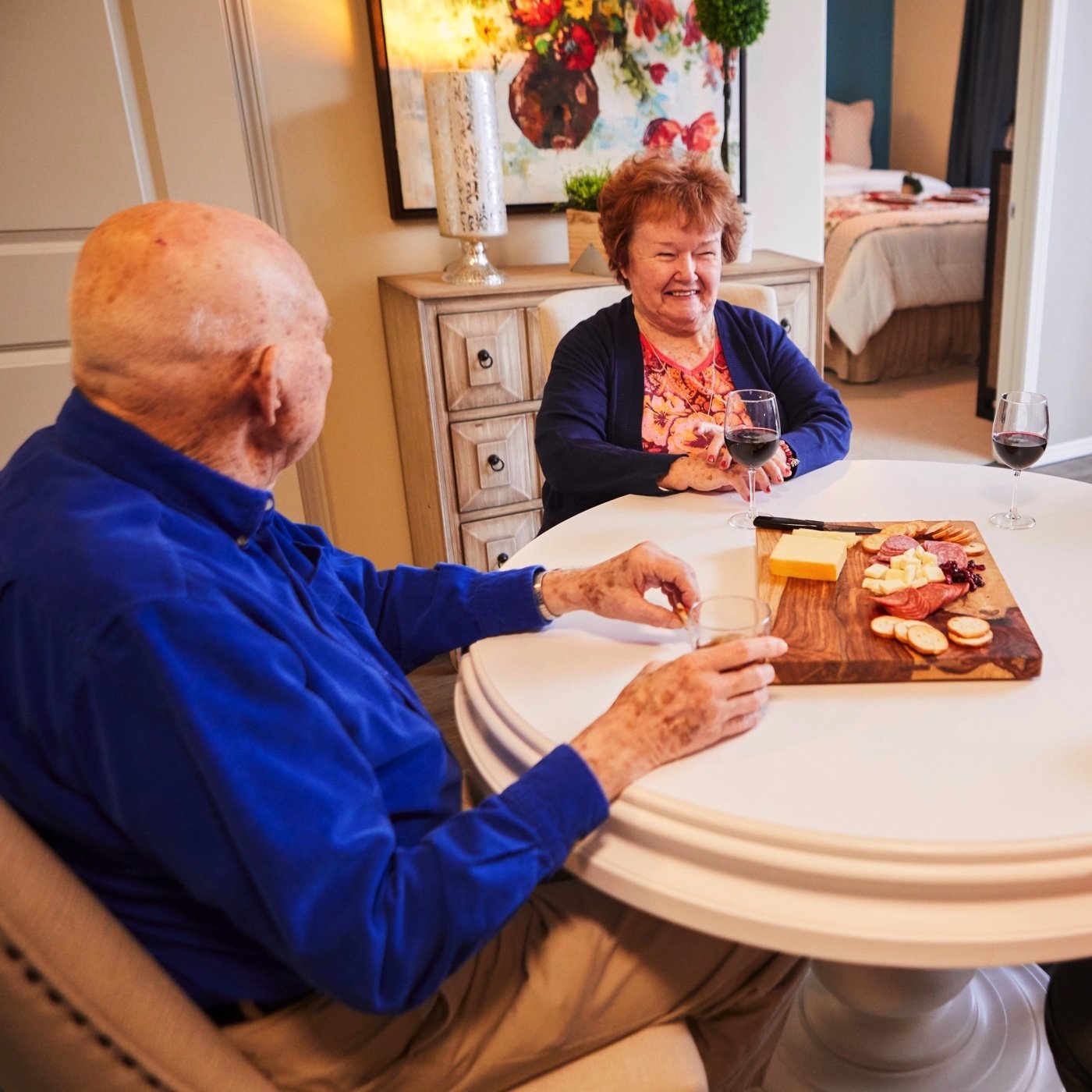 EdisonLakes_Lifestyle_ConnectingOthers_Residents_Drinking_Wine_Eating_Cheese_Smiling