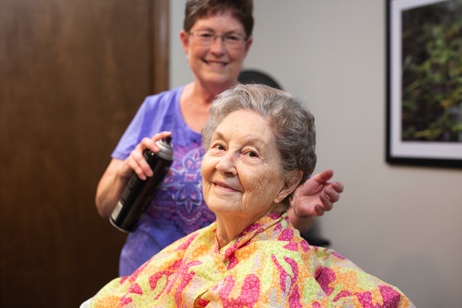 Elderly woman getting a haircut