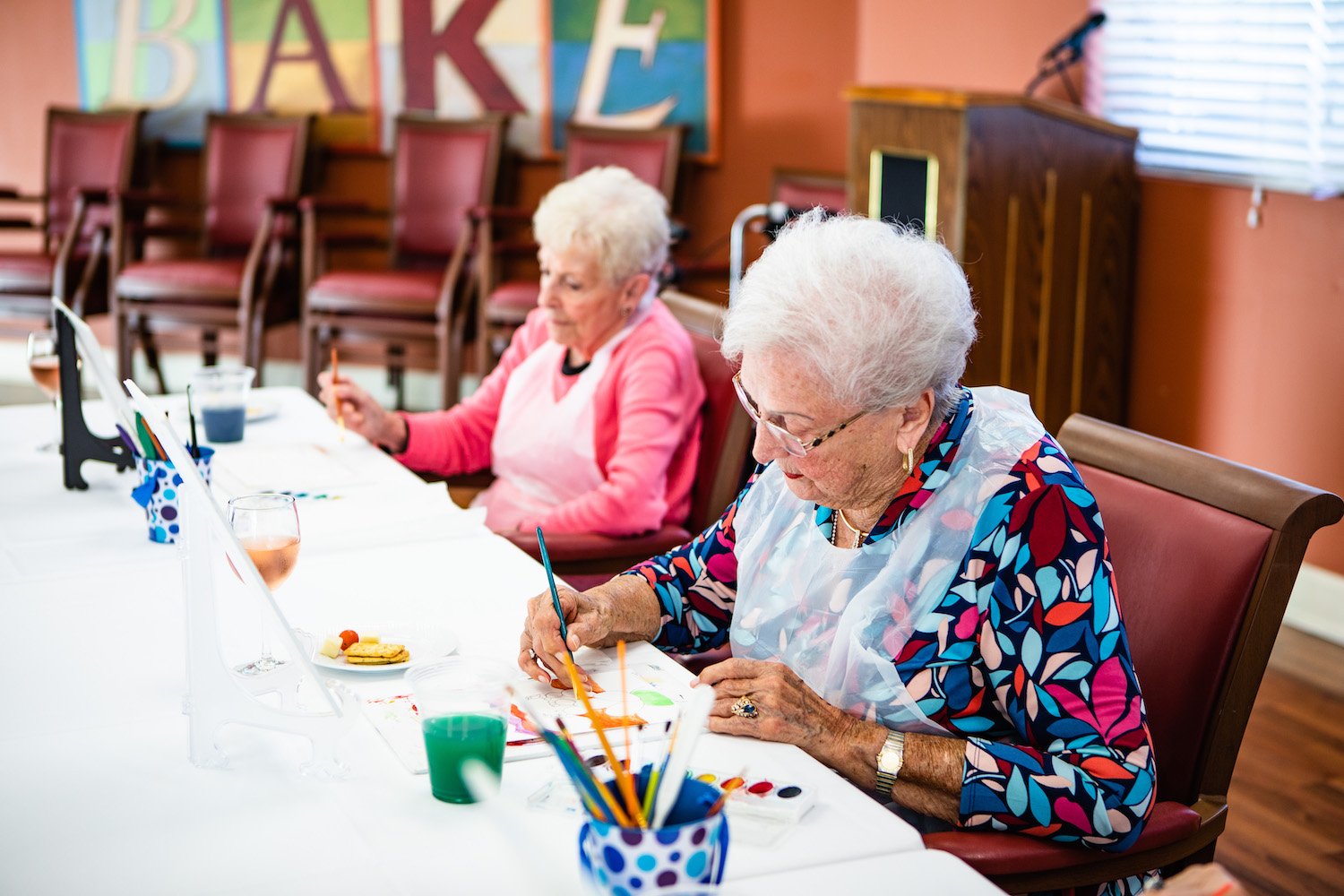Residents enjoying a painting class together