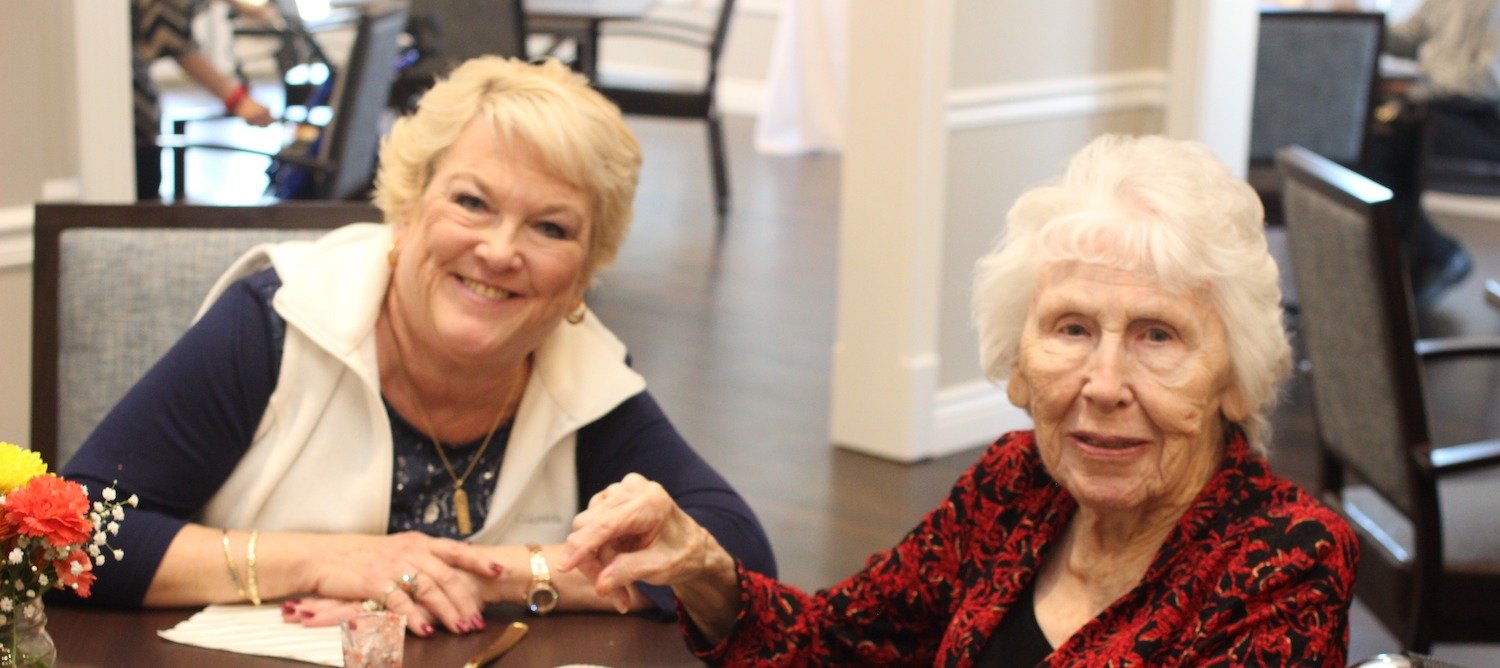 Senior women socializing at a table