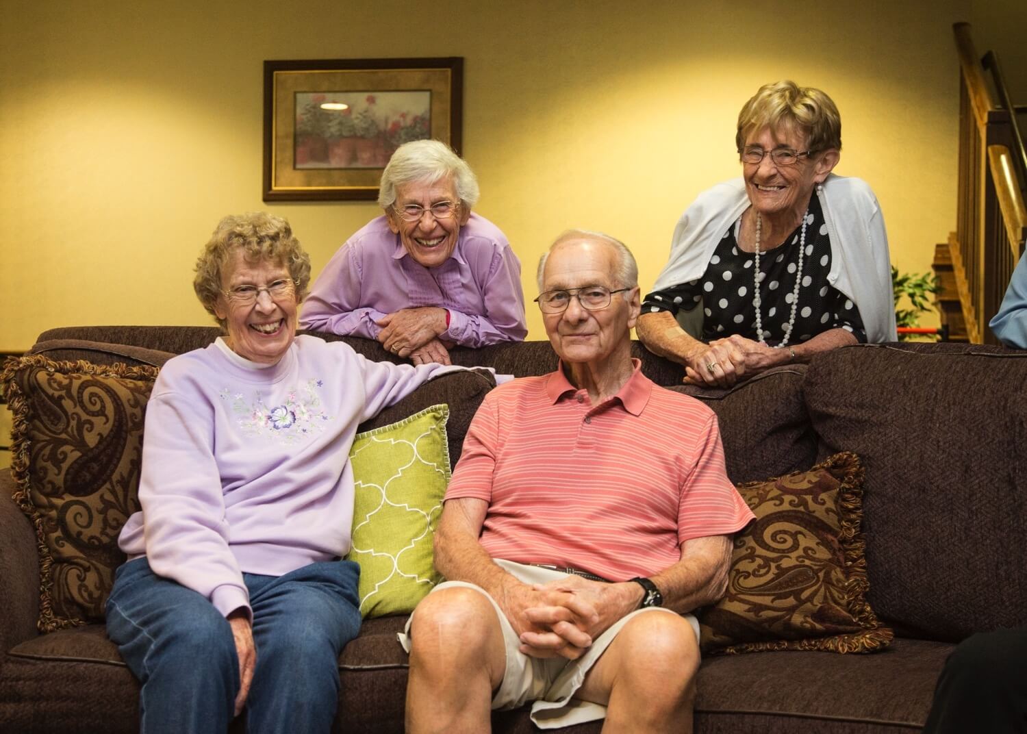 Group of happy seniors on couch