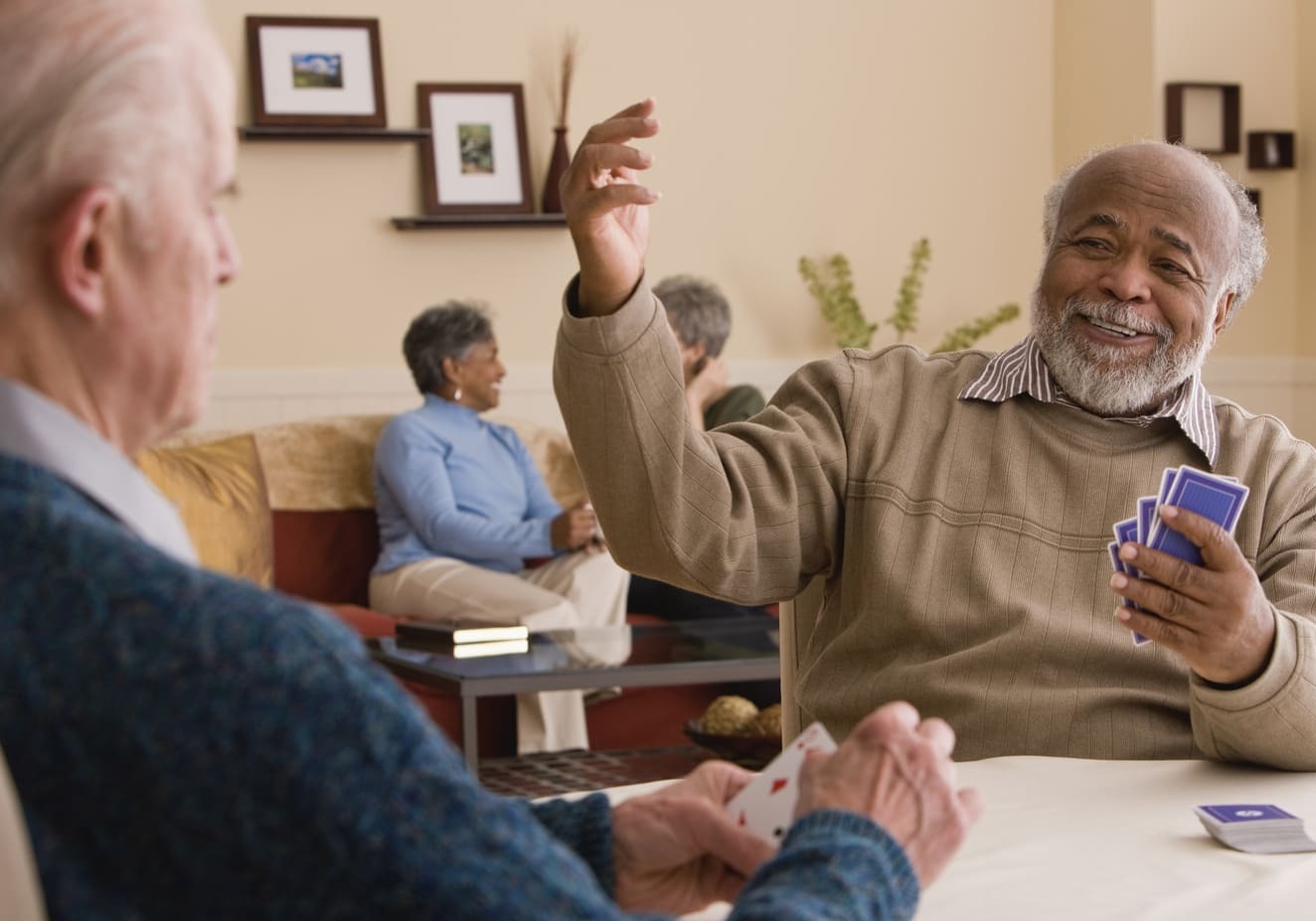 Two senior men playing cards