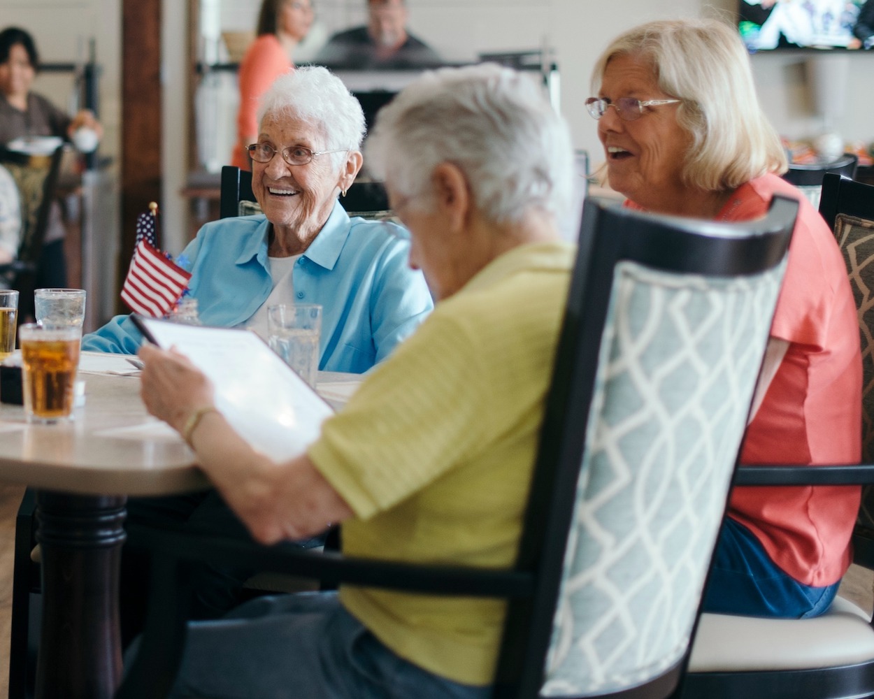 Seniors dining With Friends