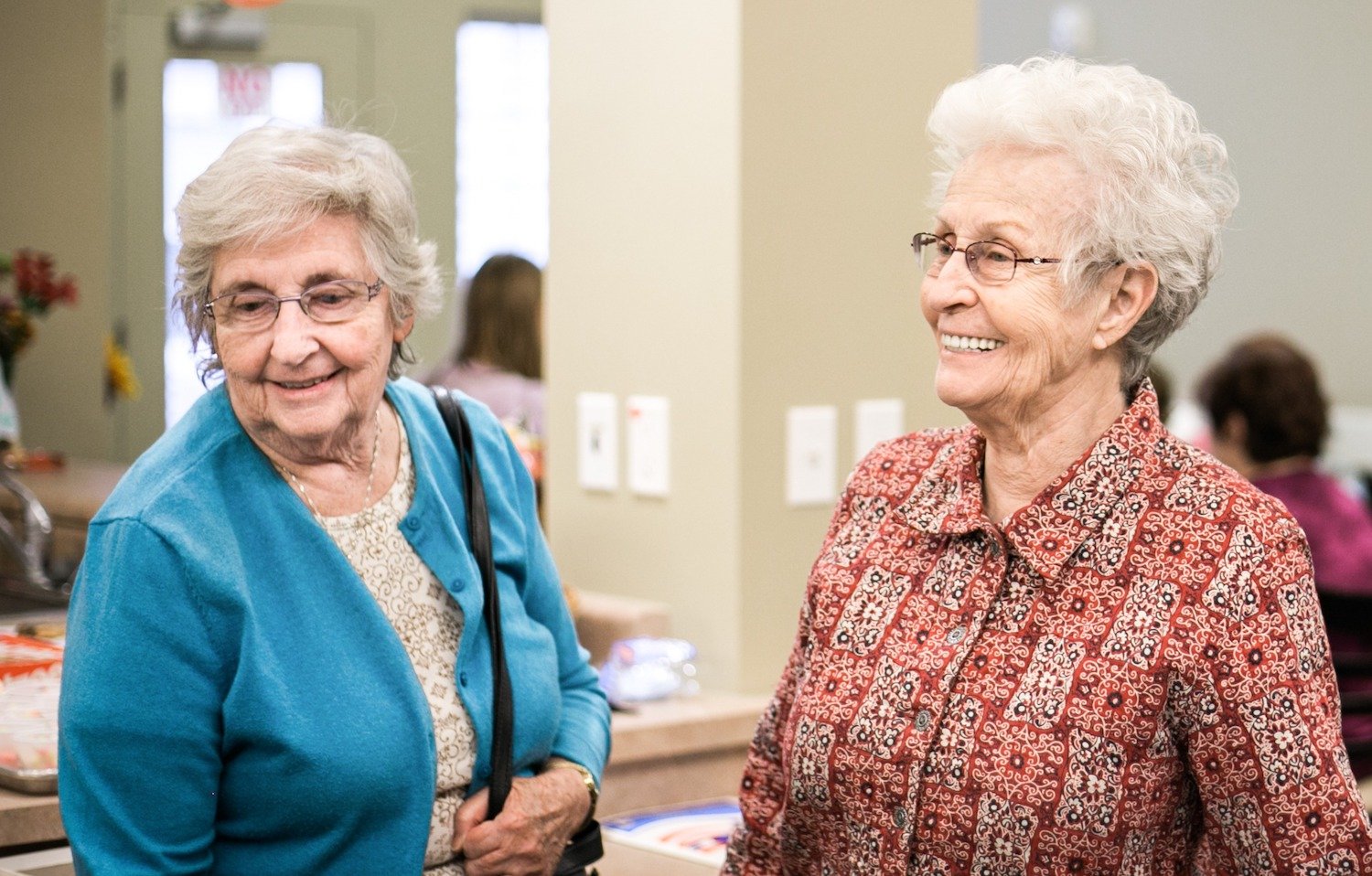 Two senior women smiling together