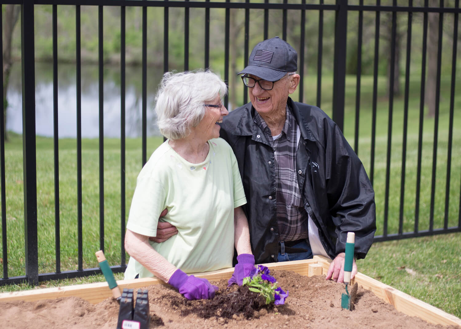 Senior couple gardening outdoors