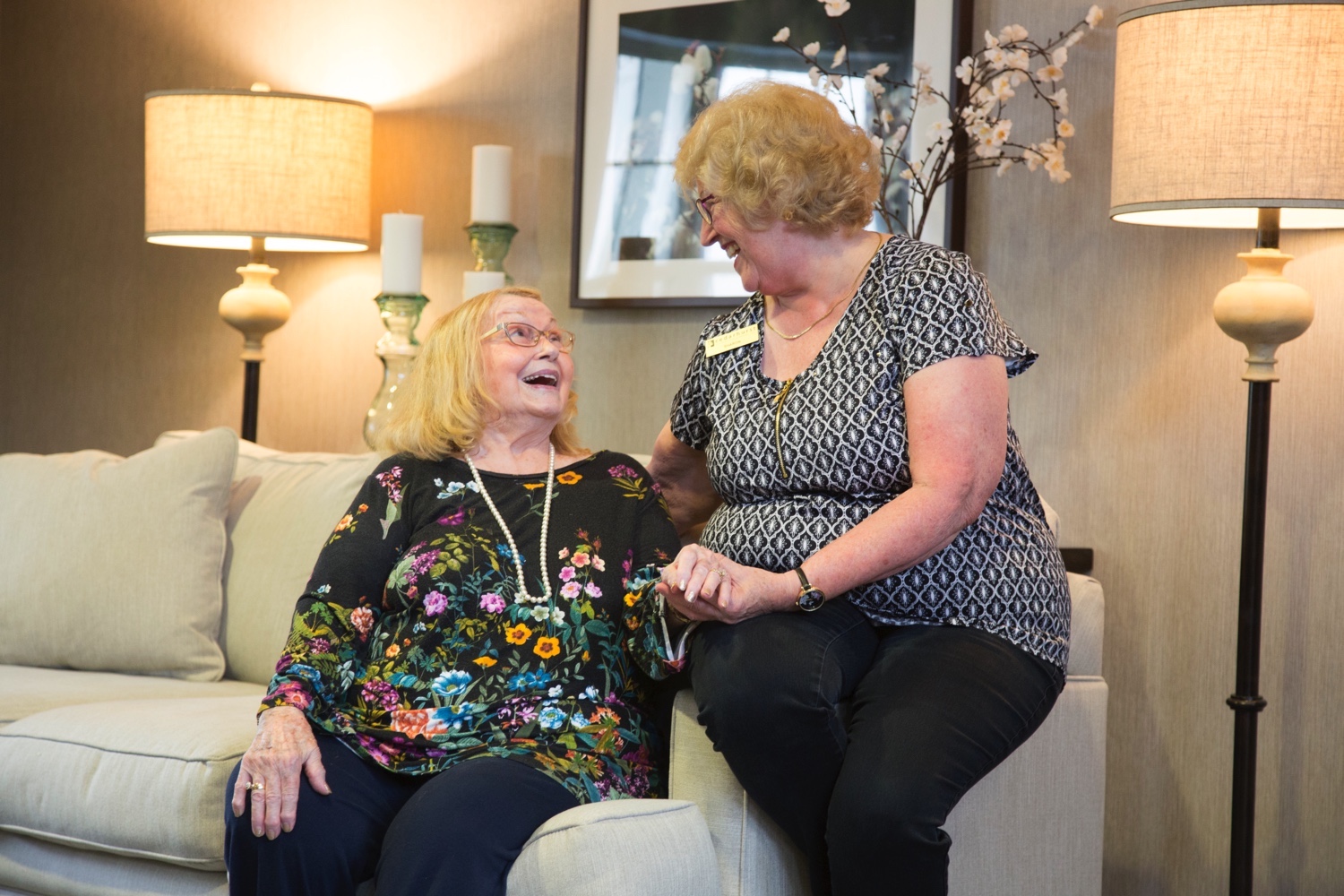 Resident laughing with staff member
