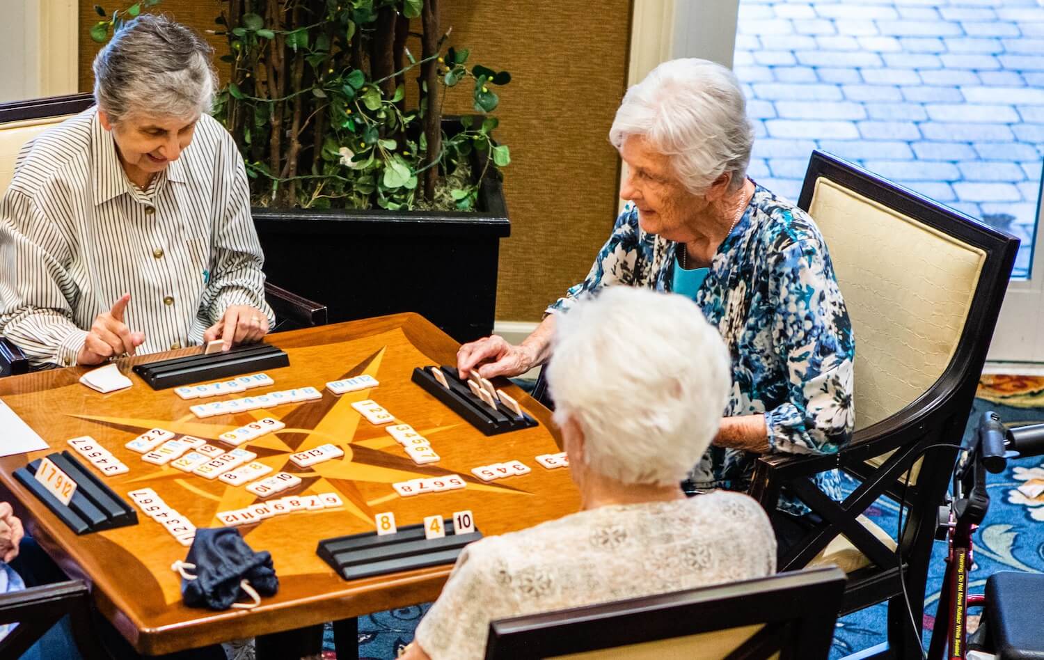 Senior friends playing Rummikub