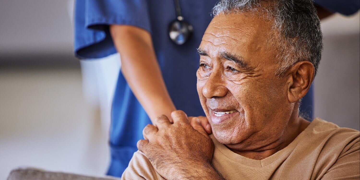 Senior man handing hands with caregiver